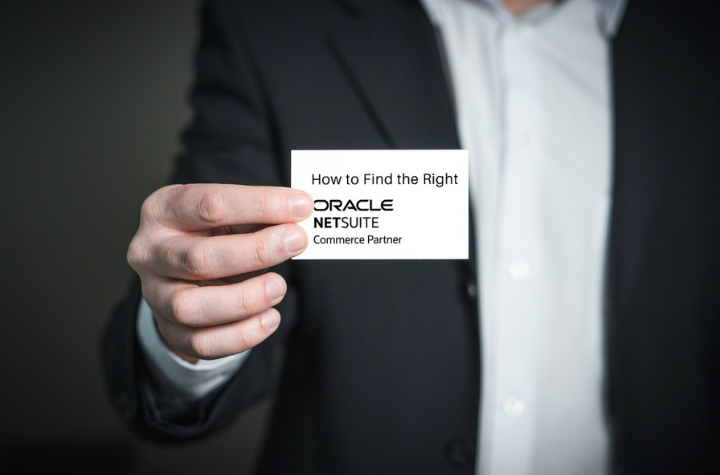 Man holding NetSuite business card
