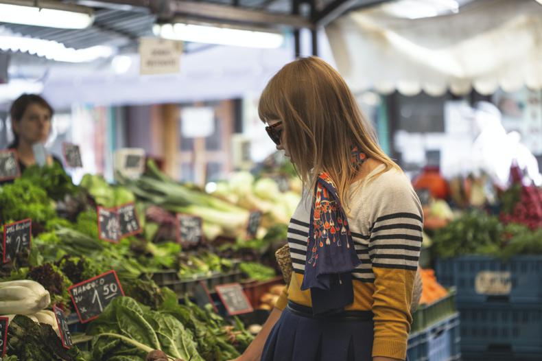 NetSuite Procurement woman standing in front of vegetables in market during day time