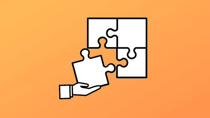 white puzzle pieces on orange background