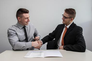 two men shaking hands customer relationship managementnet