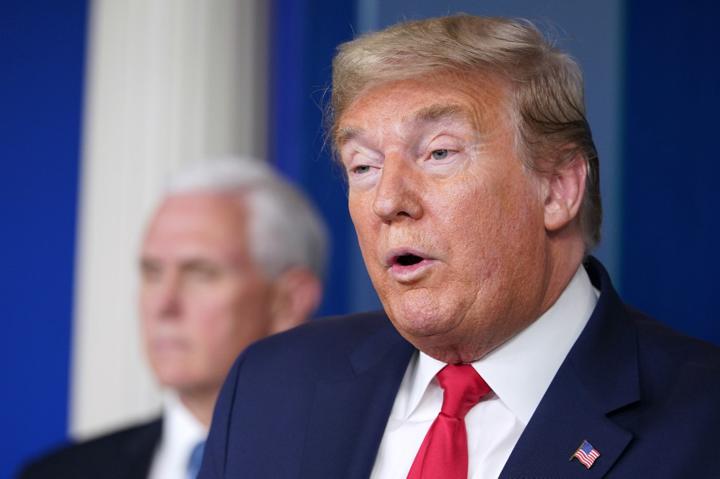 US President Donald Trump holds up an executive order withdrawing the US from the Trans-Pacific Partnership in January 2017. Photo: AFP/Saul Loeb