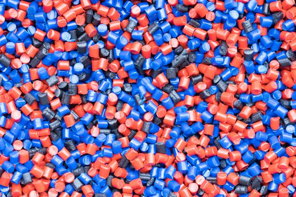 mixture of red and blue polymer pellets
