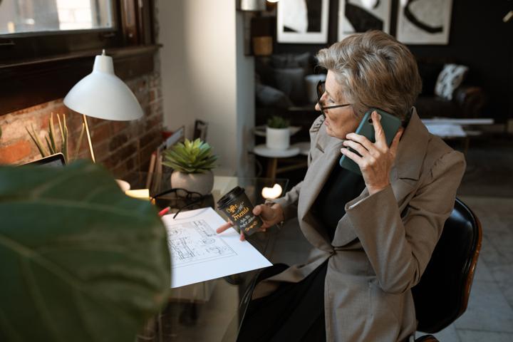 Woman talking on phone working remotely