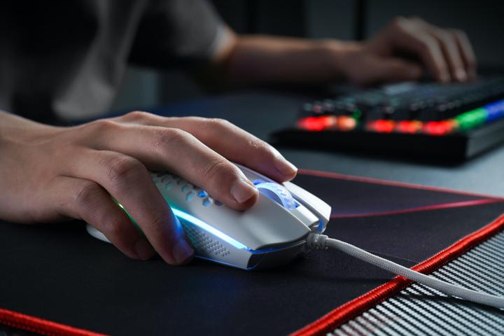 person holding black and gray computer mouse
