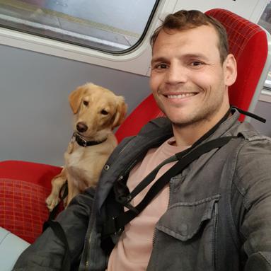 Nico with a puppy on the train