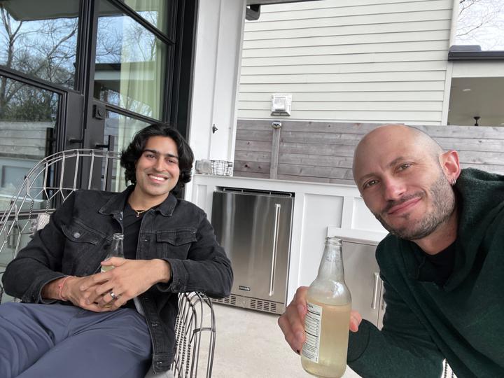 Arjun and Noah sharing a drink in Austin