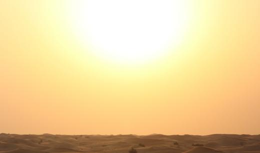 beige sand during sunset