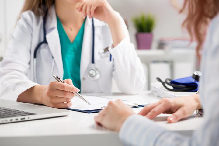 Doctor consultation with patient at desk