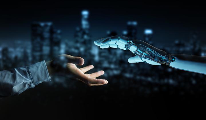 Image of human and robot hand joining together