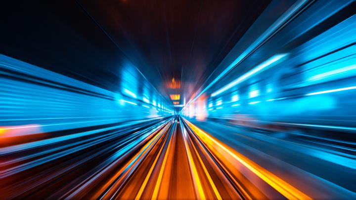 Photograph of fast moving lights in tunnel