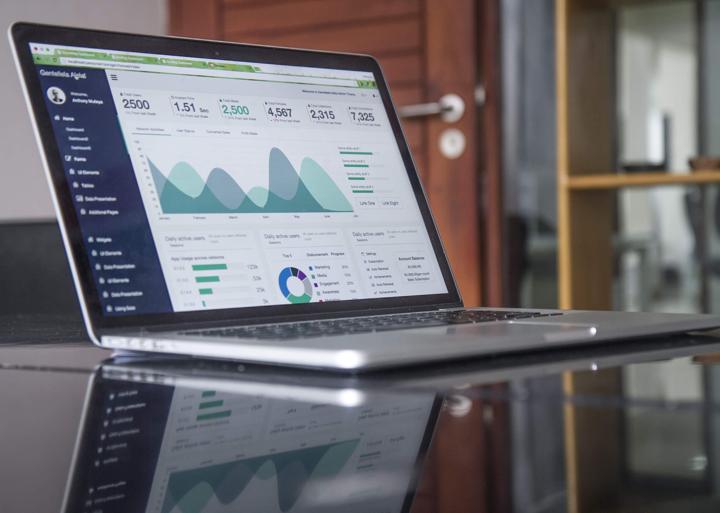 laptop computer with graphs of usability score history