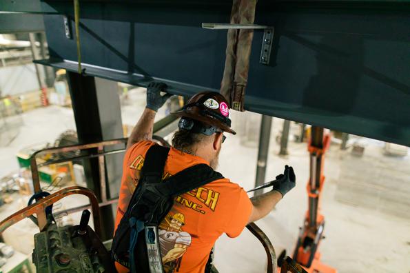 crane worker repairing beam