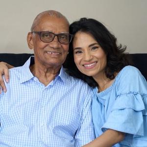 Caregiver smiling with her father