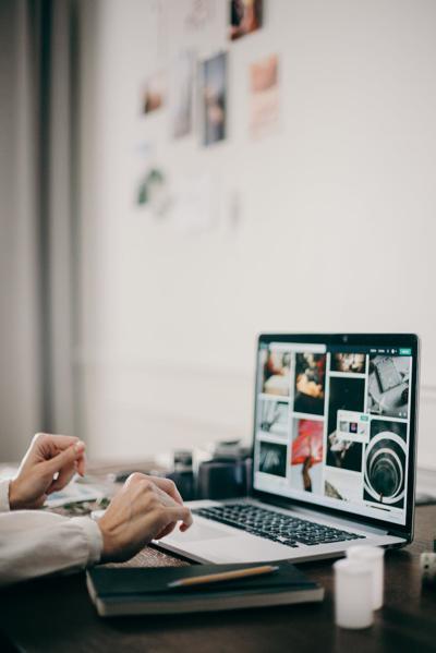 Person viewing website copy and design templates online.