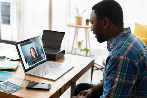 Man talking with women on computer